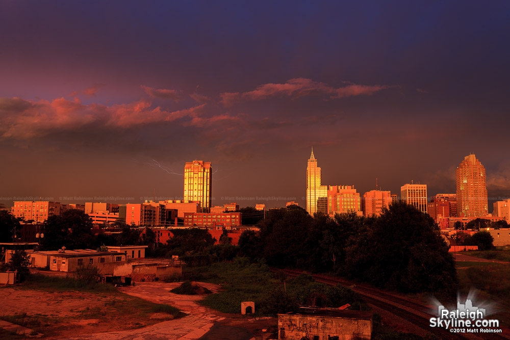 Multi-colored Sunset and Lightning with downtown Raleigh