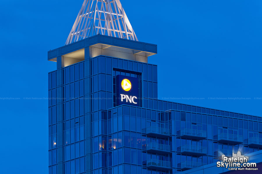 PNC Bank sign lit up at night in Raleigh