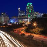 City traffic with downtown Raleigh from Western Boulevard Overpass