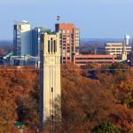 NCSU Bell tower with changing leaves