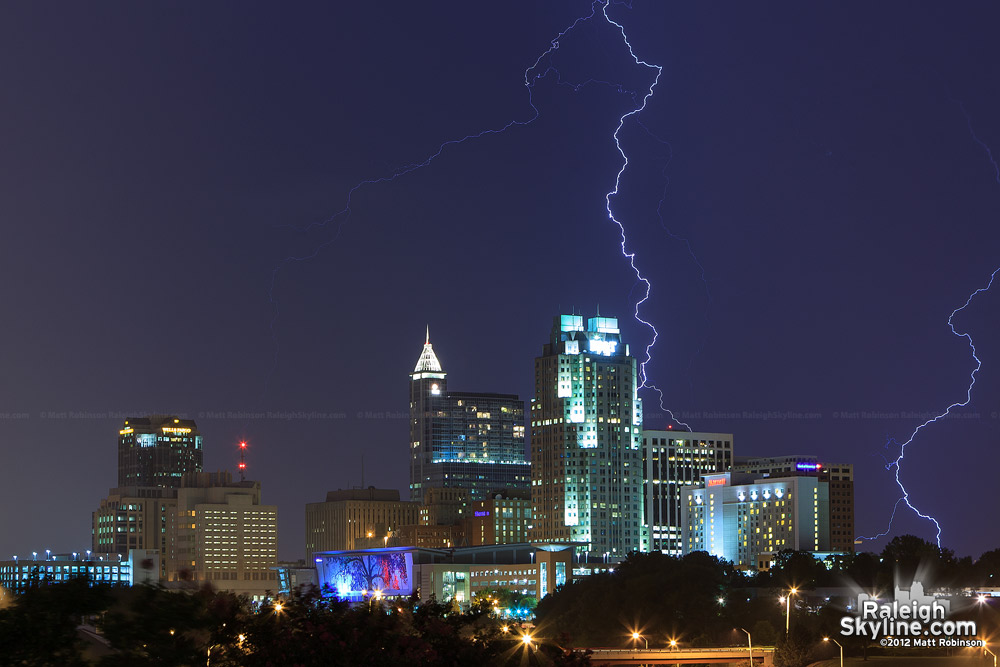 Lightning strikes behind downtown