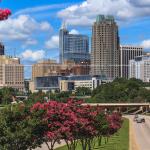 Raleigh skyline with blooming crepe myrtle trees