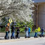 Segway tour attendees cross North Wilmington Street in Raleigh