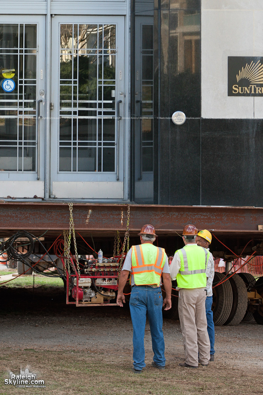 The 17 story SunTrust Tower was hoisted on a massive platform for the day long move