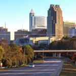 Fall morning skyline with Raleigh marathon runners