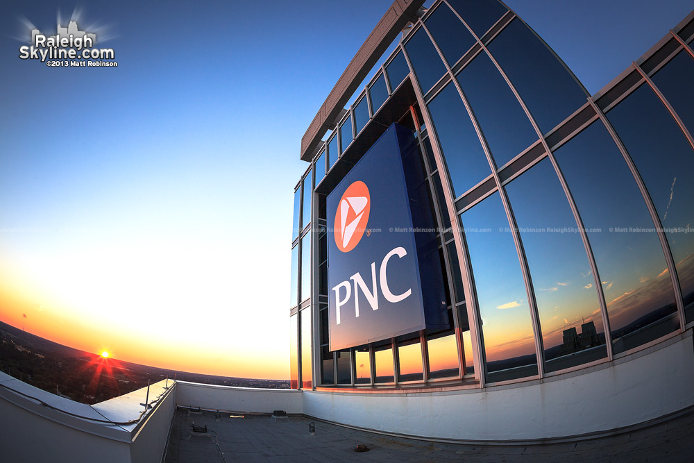 PNC sign atop PNC Plaza from roof at sunset