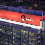 Red Hat Tower sign at night from PNC Plaza rooftop