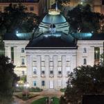 Nighttime view of the North Carolina State capital at night from PNC Plaza