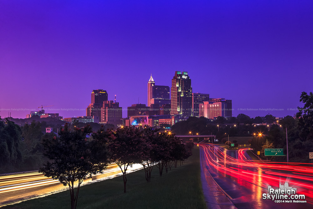 Purple hues and pink reflections bath downtown Raleigh at sunset after a storm - July 27, 2012