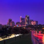 Purple hues and pink reflections bath downtown Raleigh at sunset after a storm - July 27, 2012