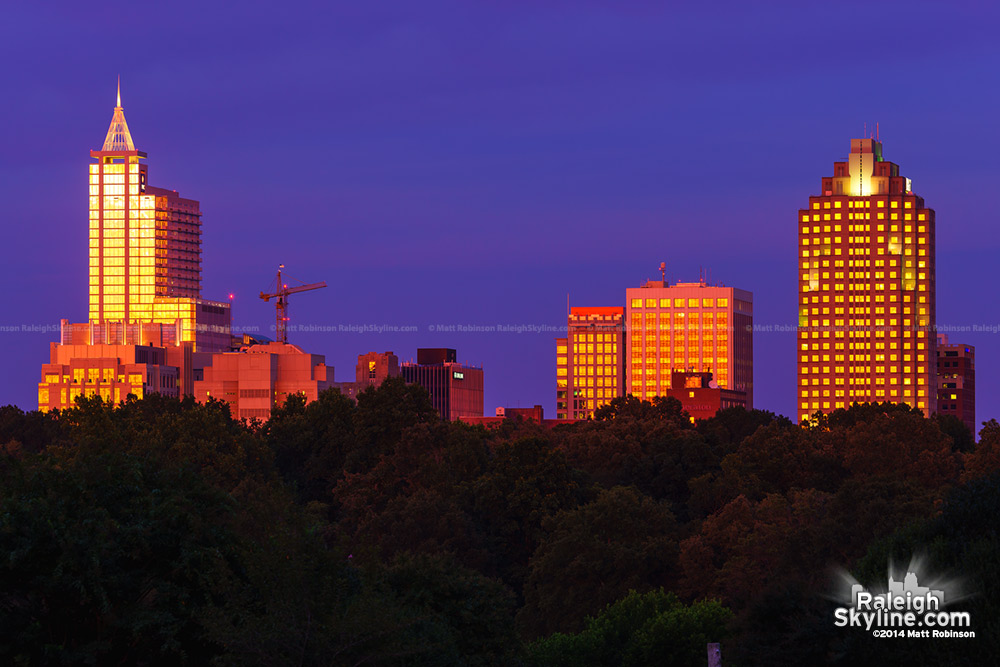 Sunset reflections shine on the Raleigh Skyline