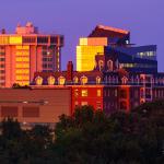 Holiday Inn, SECU and Bloomsbury estate reflect orange sunset