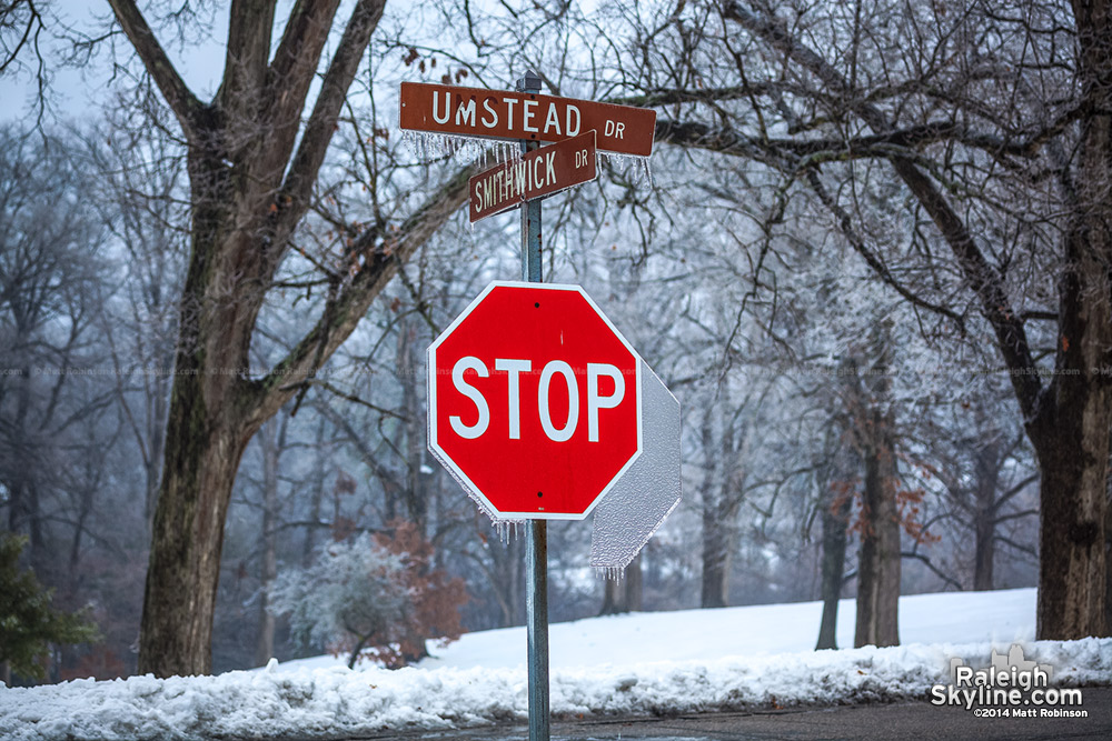 Ice covered stop sign and street signs at Dorothea Dix 