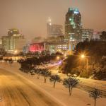 Abandoned cars litter South Saunders Street with downtown Raleigh looming