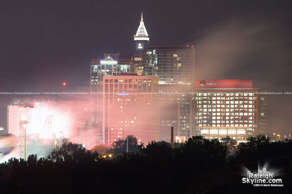 Smoke and fire smoldered into the night after the implosion of the BB&amp;T Building