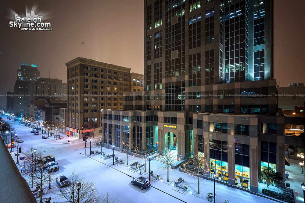 Downtown Raleigh's Fayetteville Street blanketed in snowfall at night