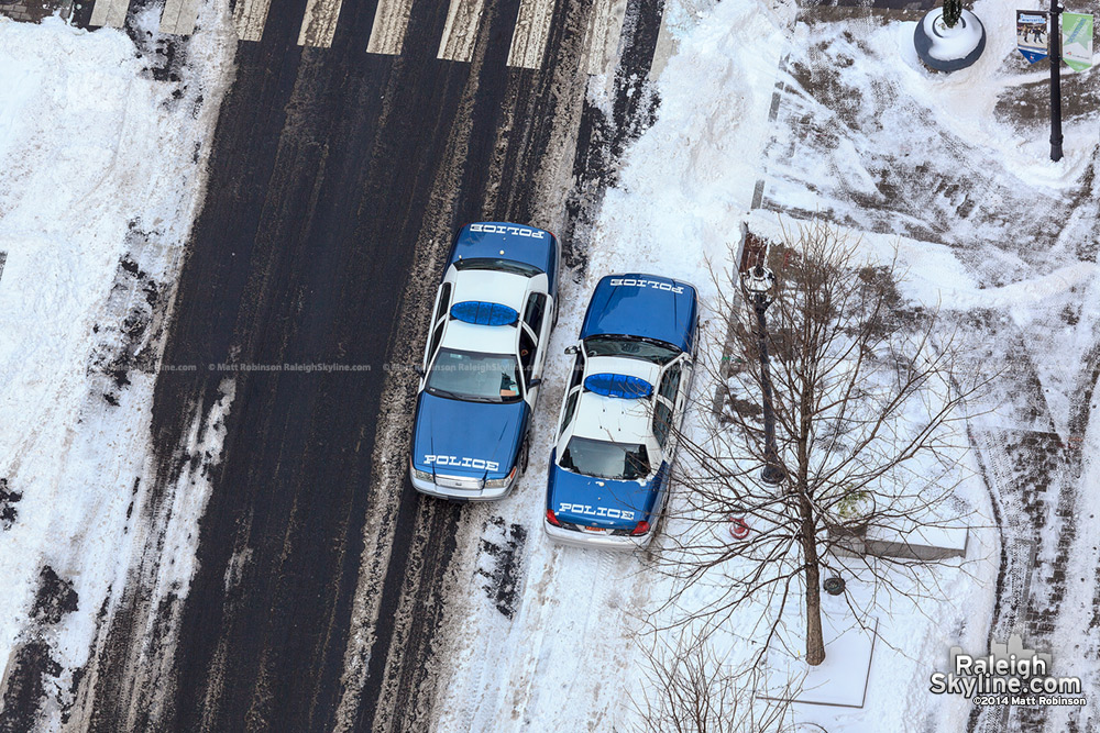 Aerial of Raleigh Police side by side on Fayetteville Street in the snow