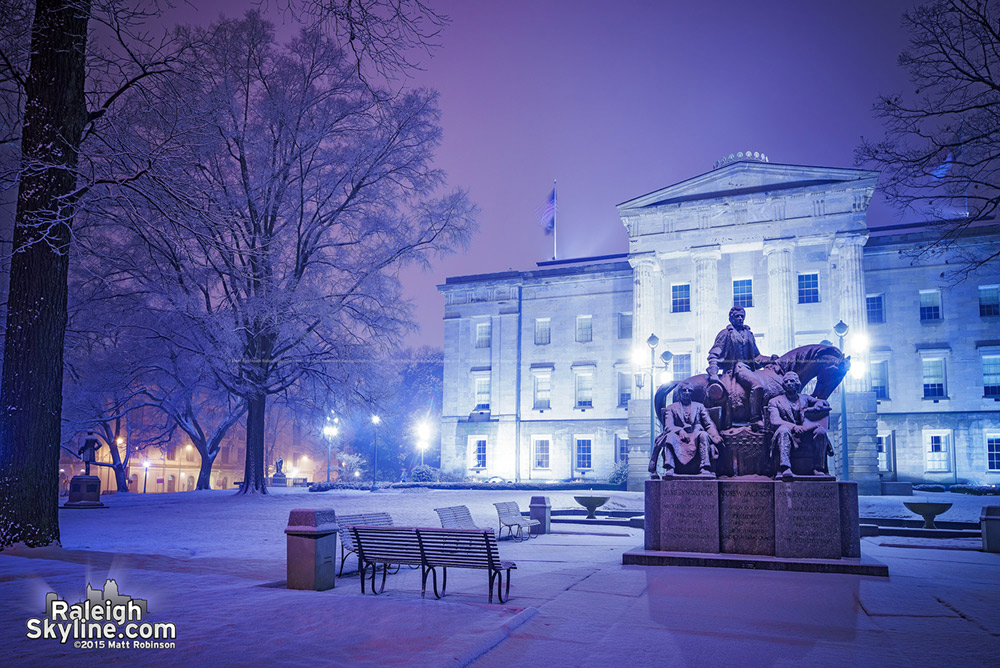 Midnight snow covering the NC State Capitol Building grounds