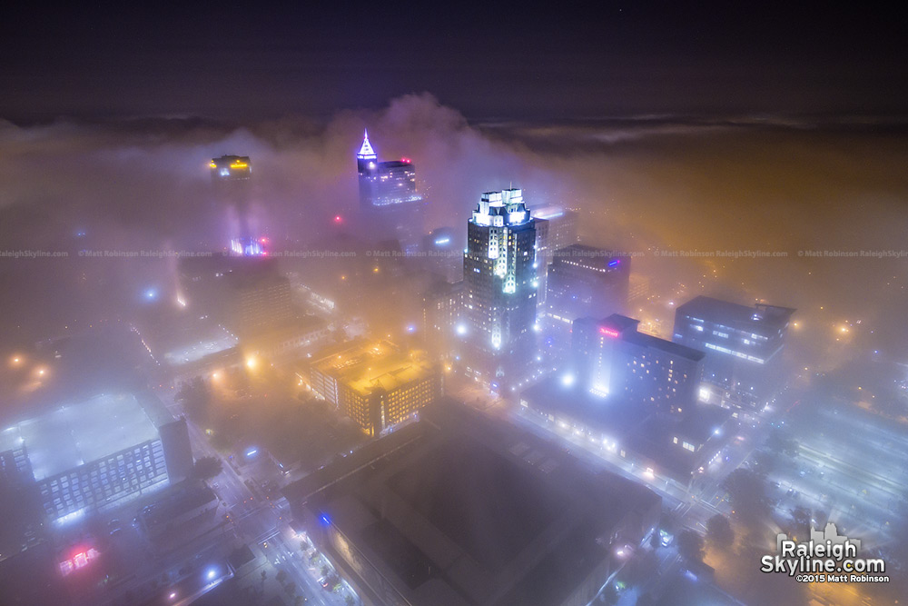 Raleigh North Carolina at night with fog enshrouding the city