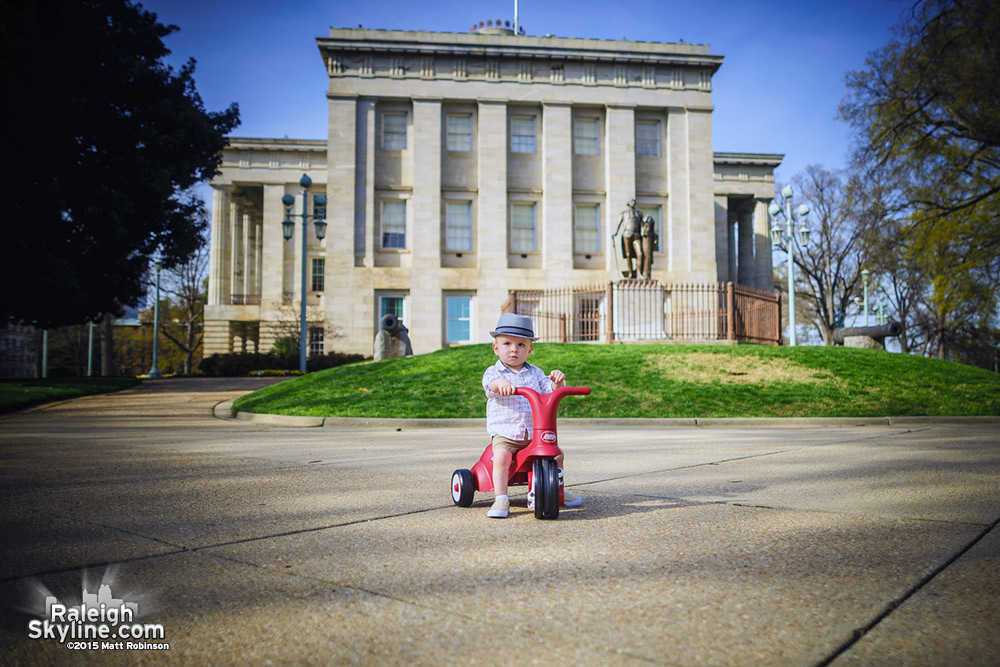 Oliver rides around the State Capitol