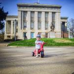 Oliver rides around the State Capitol