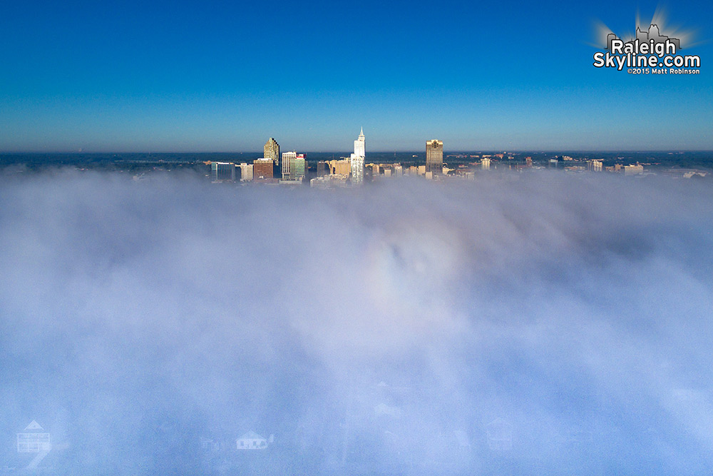 Downtown Raleigh rises above fog covering the east side of downtown