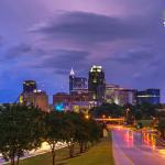 Colorful sunset post thunderstorm over the Raleigh skyline