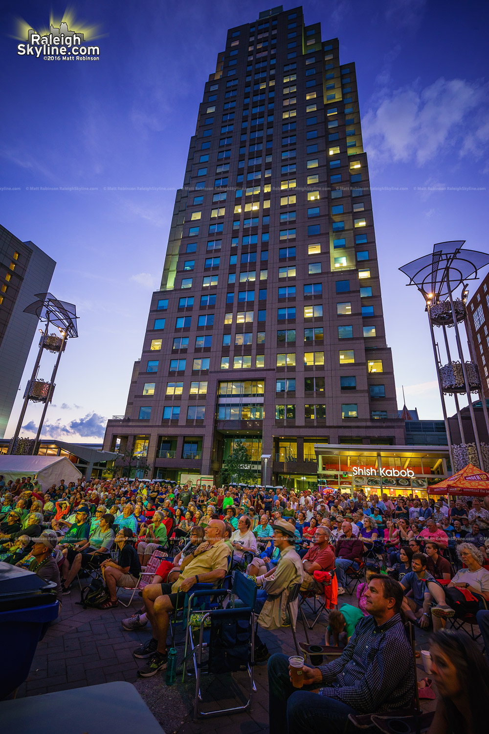 Spectators at Wide Open Bluegrass in downtown Raleigh at night