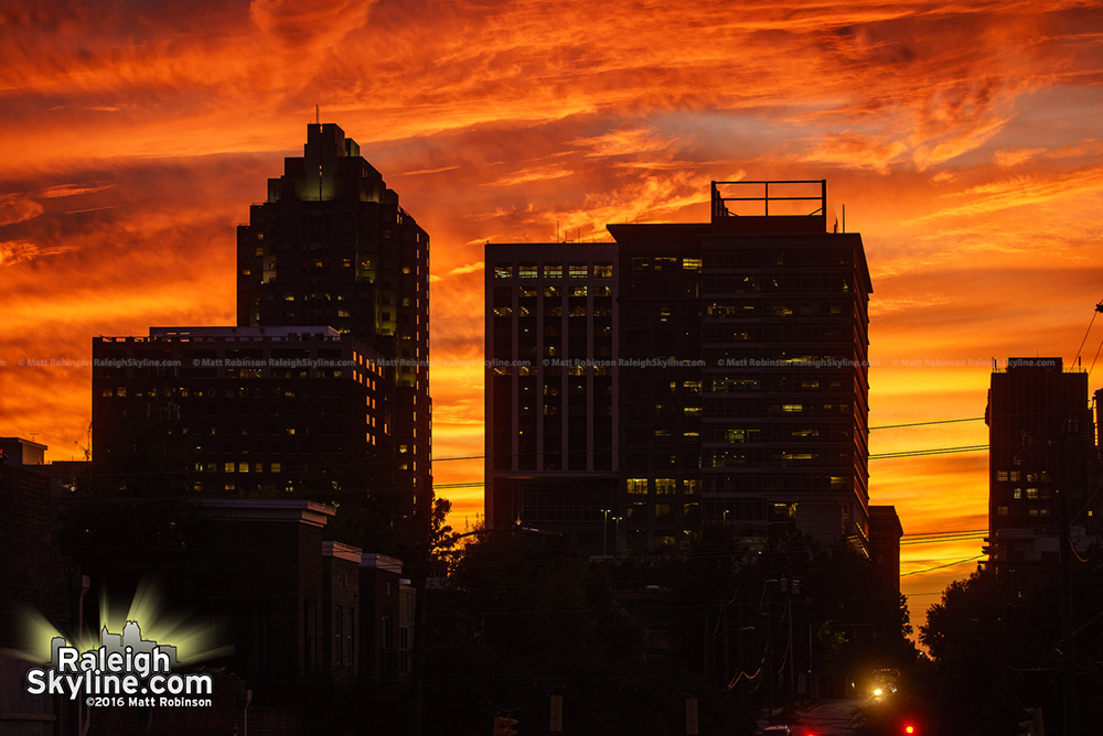 Orange skies behind the Raleigh Skyline