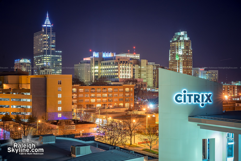 Citrix Sign with Downtown Raleigh at night