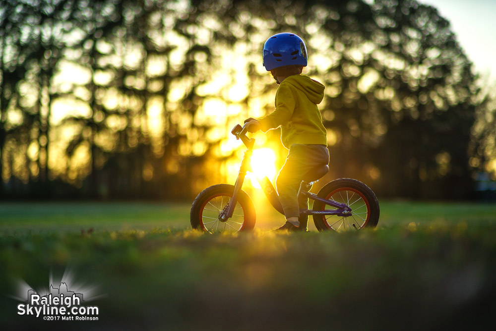 Bike rides through Dorothea Dix at sundown