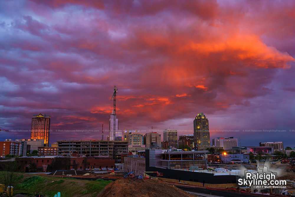 Bright orange clouds over downtown at sunset