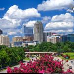 Cumulus clouds over the Raleigh skyline with blooming Crepe Myrtles -Summer 2017