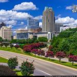 Cumulus clouds over the Raleigh skyline with blooming Crepe Myrtles -Summer 2017