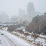 Downtown Raleigh fades into the falling snow