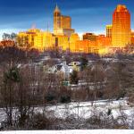 Sun illuminates the Raleigh Skyline from Dorothea Dix after snow