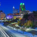 Blue hour downtown Raleigh skyline with snowy roads