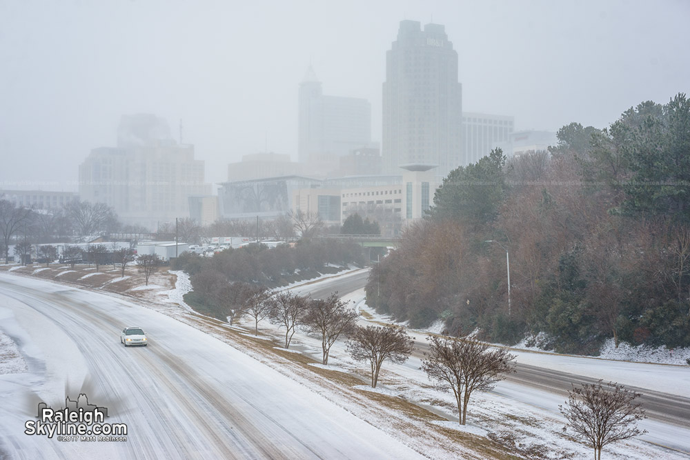 Downtown Raleigh fades into the falling snow