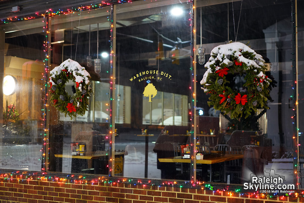 Warehouse District Christmas Wreaths covered in snow