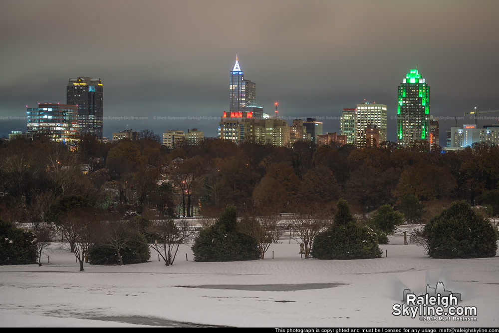 Raleigh Skyline from Dorothea Dix Park at night in the snow