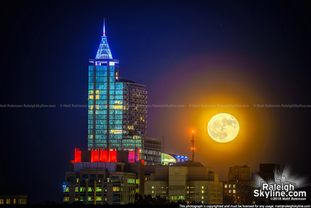 Moonrise behind PNC Plaza from Dorothea Dix Park
