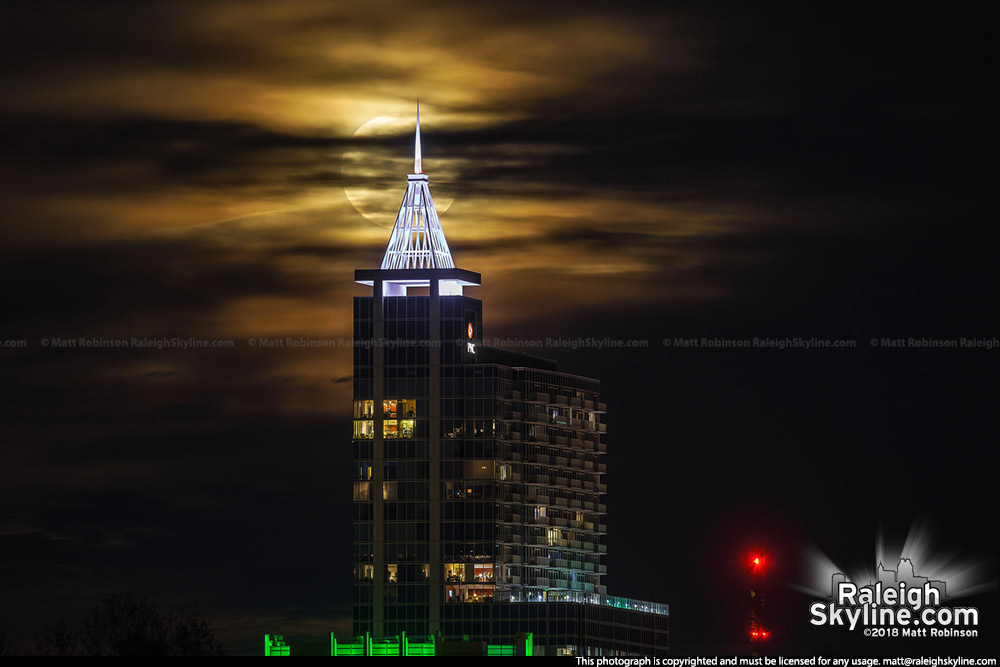 Cloudy moonrise behind Raleigh