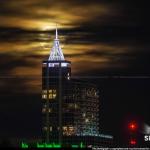 Cloudy moonrise behind Raleigh