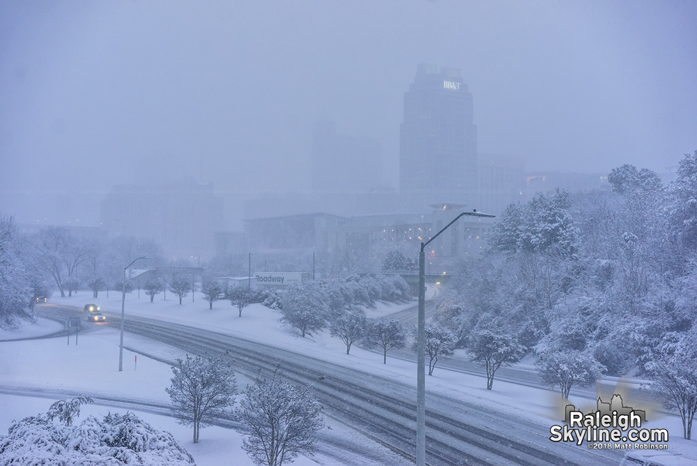 Snow begins to taper of as downtown slowy emerges