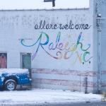 Raleigh All are Welcome sign in the snow