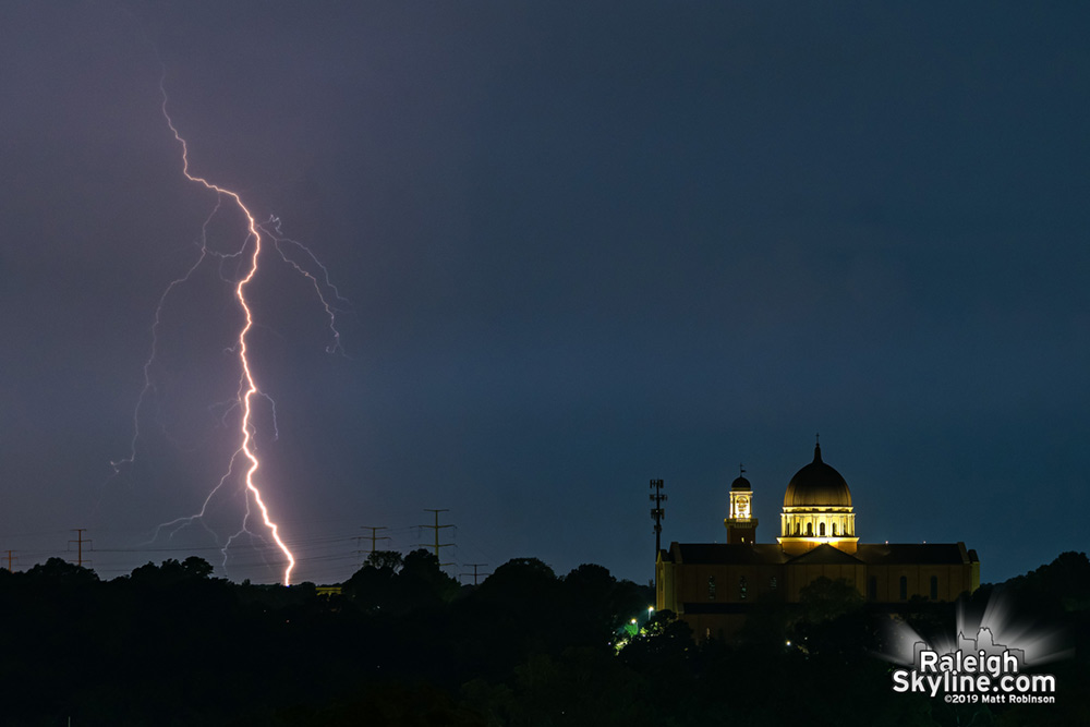 Lightning strike behind Raleigh's cathedral dome