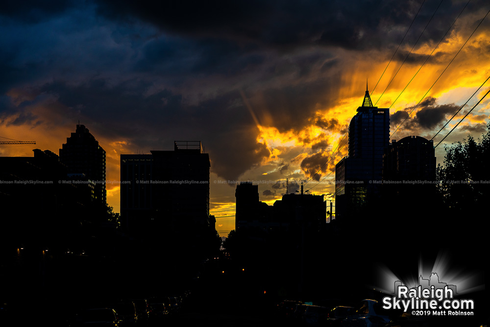 Sun rays burst behind Raleigh