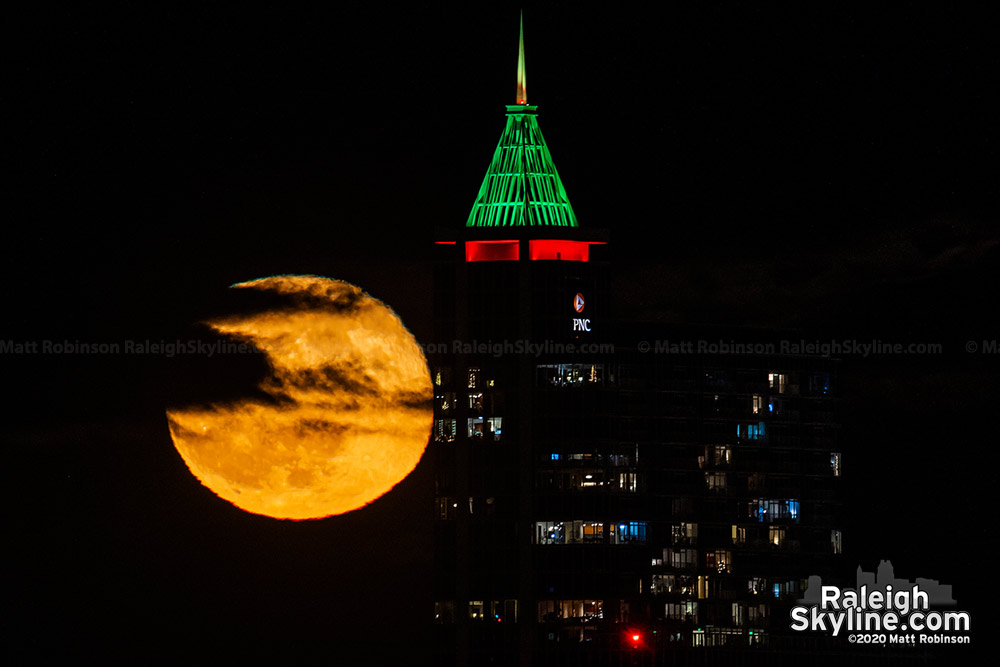 Moon rise behind the Christmas Tree atop PNC Plaza.