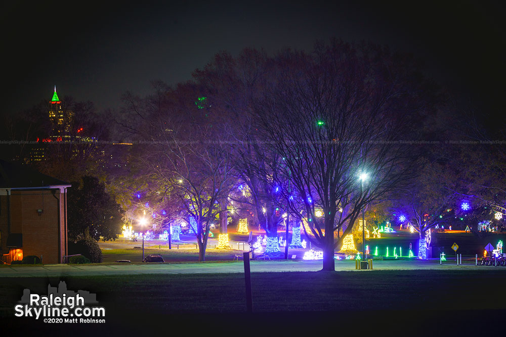 Christmas lights at Dix Park with downtown Raleigh