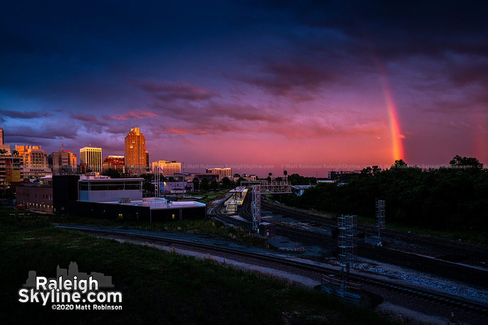 Pink sunset with Rainbow over downtown Raleigh